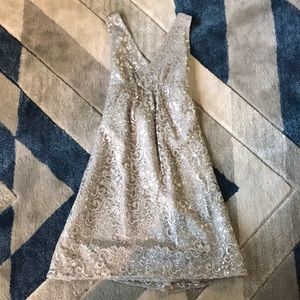 Perfect condition, silver dress with bow in back!